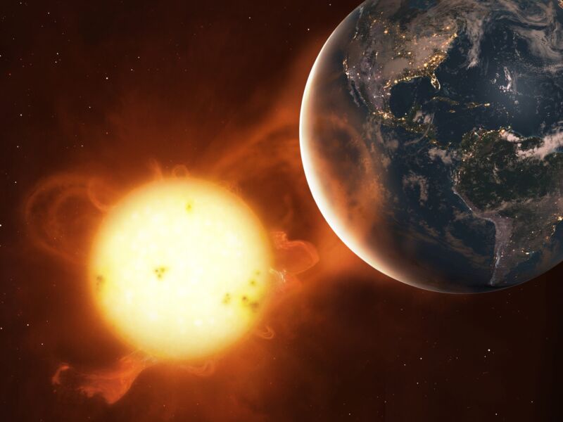 Illustration of Earth being hit by a coronal mass ejection from the Sun.