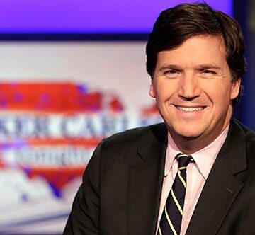 WATCH: A Tucker Carlson fan trolls a live broadcast of Fox News hard (and have we identified the troll)? WATCH: A Tucker Carlson fan trolls a live broadcast of Fox News hard (and have we identified the troll)?